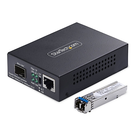 Schwarzer Gigabit Ethernet Konverter mit Stecker und Licht, daneben ein silbernes Modul mit blauem Stecker.