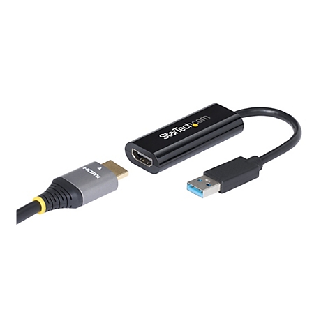 Ein schwarzer HDMI zu USB-Adapter von StarTech, mit Anschlüssen und Kabeln vor weißem Hintergrund.