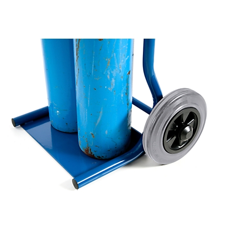 Blue painted transport trolley with two gas cylinders. One wheel is partially visible.