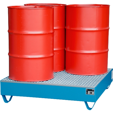 Three red barrels stand on a blue drip tray with a grating.
