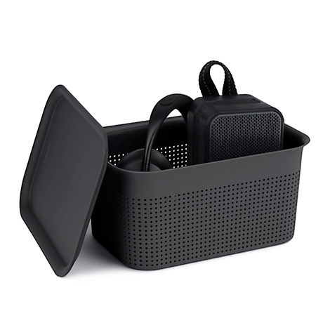 Black storage box with headphones and speaker.