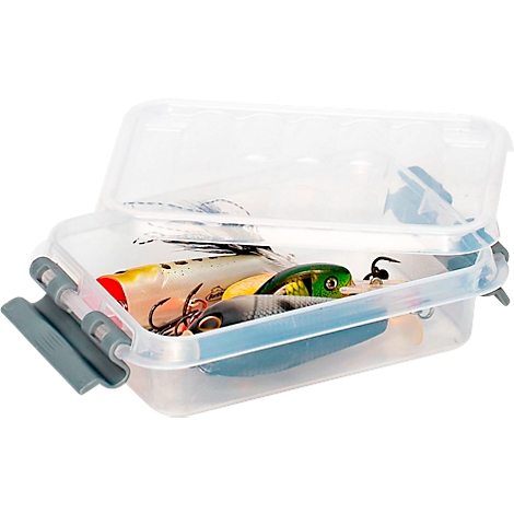 Clear tackle box with the lid open, filled with fishing lures in various colors and shapes.