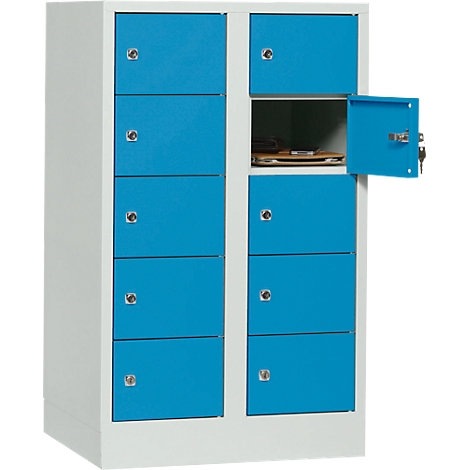 Blue cabinet with multiple compartments, one open. Objects can be seen in the open compartment.