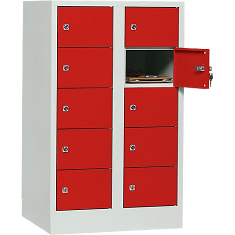 Cabinet with red doors, one door is open, key in the lock.