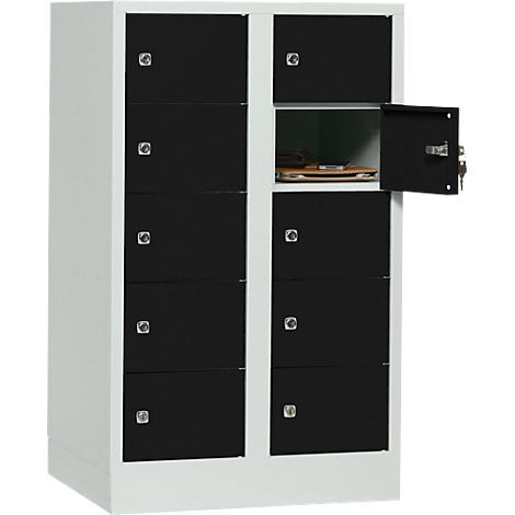 A white locker with black doors, one door is open, objects are inside.