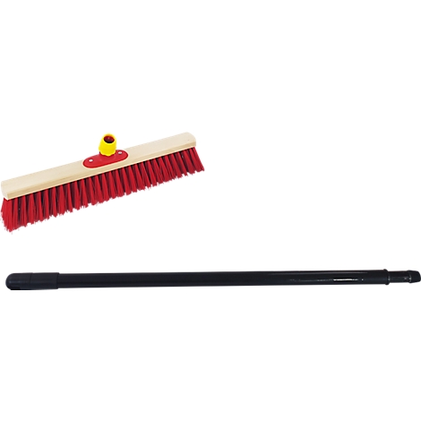 Broom with red bristles, light brown wood and black handle. Yellow element on the brush head.