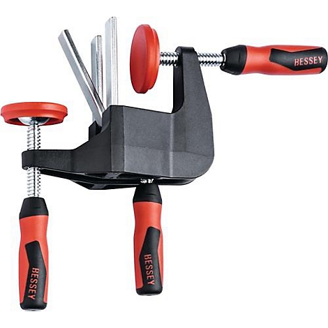 Zwarte klem met rode handvatten en de tekst "BESSEY".