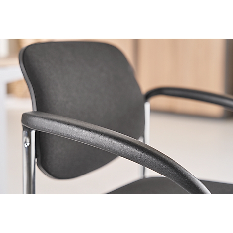 Close-up of a black office chair with armrest and backrest.