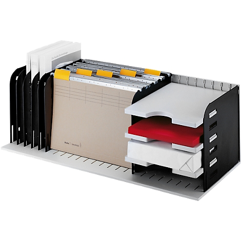 Black, two-part desk organizer with trays, files and stacks of paper.