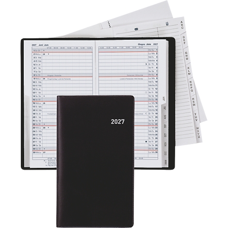 Carnet noir avec l'année 2027 devant un calendrier ouvert avec un aperçu des dates.