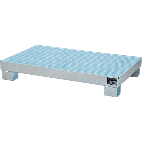 Metal pallet with grating. A rectangular metal construction stands on four feet. The surface is a grating, the rest of the pallet is silver.