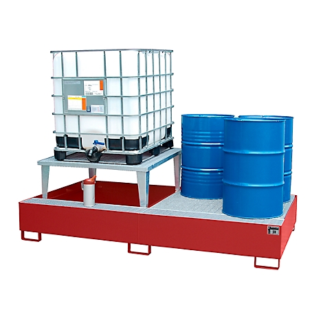 A large tank, barrels and a container stand on a red tub. Spill containment below.