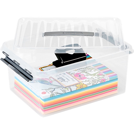 Transparent storage box with lid, filled with paper, pens, and a binder clip.