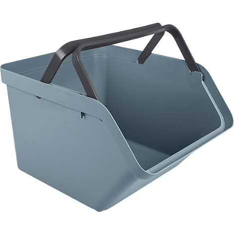 Light blue shopping basket with black handle, made of plastic. View into the bag.