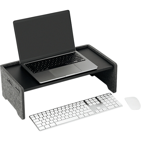 Ordinateur portable noir sur un support d'ordinateur portable en feutre gris. Un clavier et une souris sont à côté.