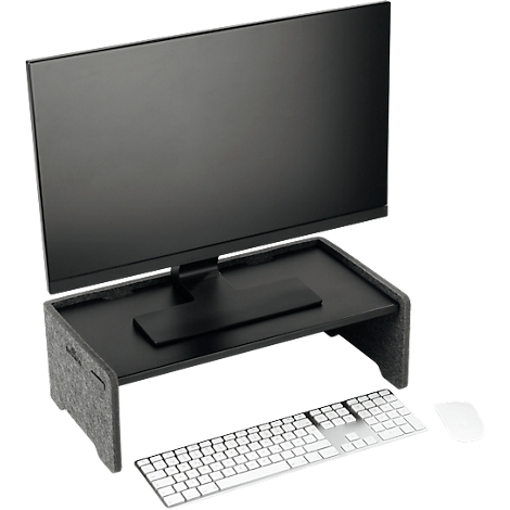 Écran noir sur un support avec des côtés en feutre gris. Un clavier et une souris sont en dessous.