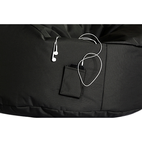 Black beanbag with integrated pocket and headphones. A mobile phone is in the pocket, headphones hanging out.