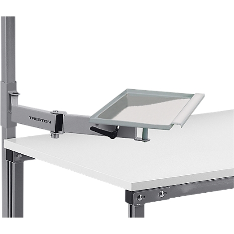 Gray tray, attached to a metal arm, mounted on a white table. The arm is attached to a metal frame.