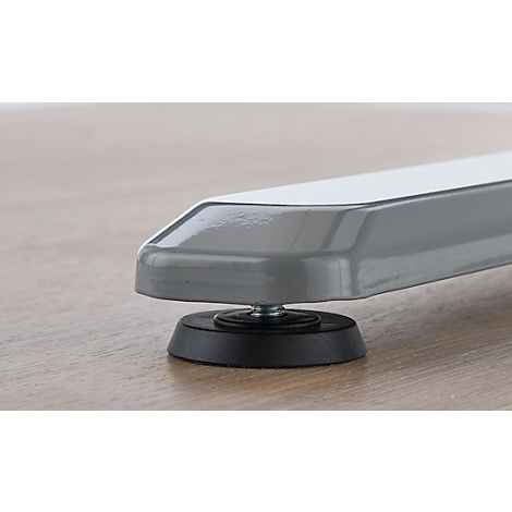 Contour d'un appareil photo avec un objectif rond sur fond blanc.