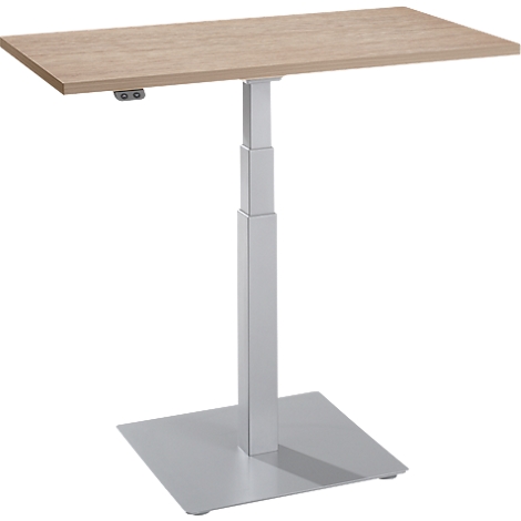 Un bureau debout réglable en hauteur avec un plateau de table brun clair et un cadre gris. Base carrée.