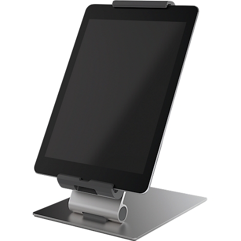 A tablet PC is set up in a silver holder. The screen is black, the holder is made of metal.