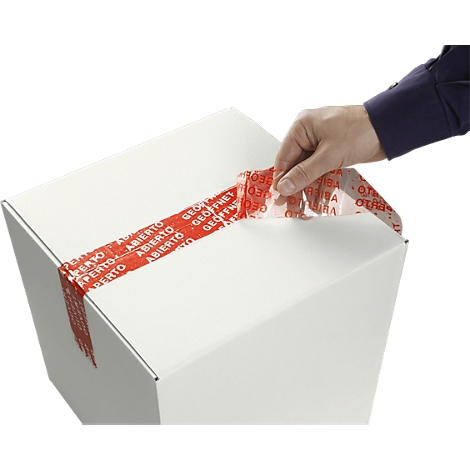 A man is opening a white cardboard box. A red tape labeled "opened" is attached to it.