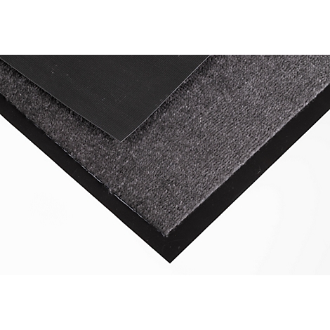 Gros plan d'un tapis gris avec un bord en caoutchouc noir et une couche noire lisse.