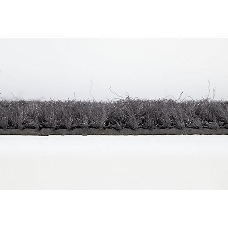 Gros plan sur un paillasson avec une bordure en caoutchouc noir et une surface textile grise.