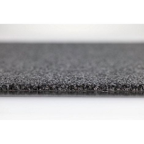 Gros plan sur la surface grise et texturée d'une moquette avec une structure en couches visible.