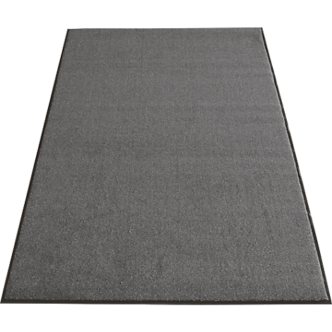 Tapis gris avec bordure noire, photographié légèrement d'en haut.