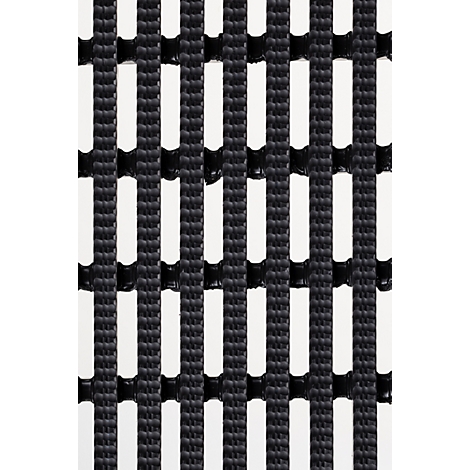 Gros plan d'un tapis noir en forme de grille avec des découpes rectangulaires régulièrement disposées.