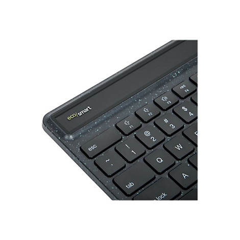 Gros plan sur un clavier noir. Le cadre a un motif moucheté. Les touches "esc", "tab", "1", "2", "3", "Q", "W", "A", "lock" sont visibles sur le clavier.