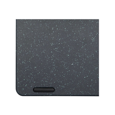 Gros plan d'une surface sombre et texturée avec des points vert clair. En bas, un élément ovale noir.