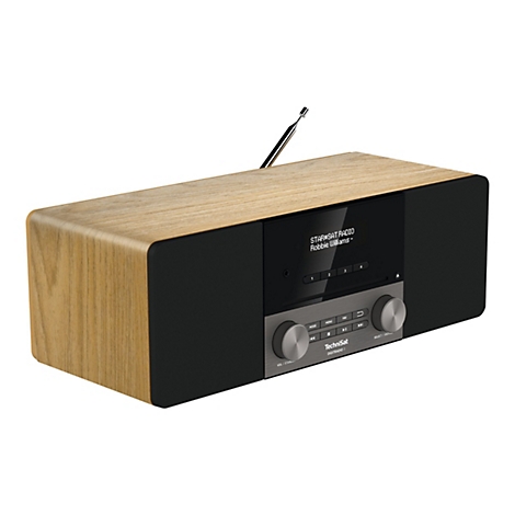 Ein helles Radio mit Holzoptik und einem schwarzen Display, auf dem "STAR SAT RADIO Robbie Williams" steht.