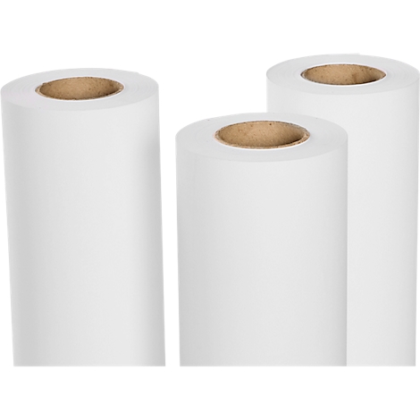Drie rollen wit papier met bruine kernen op een lichte achtergrond.