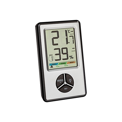 Digitales Hygrometer mit silbernem Gehäuse zeigt Temperatur und Luftfeuchtigkeit mit Trendpfeilen an.