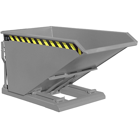 Grey metal tipping skip, yellow and black warning marking, standing at an angle.