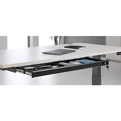 Bureau avec un tiroir ouvert contenant des fournitures de bureau.