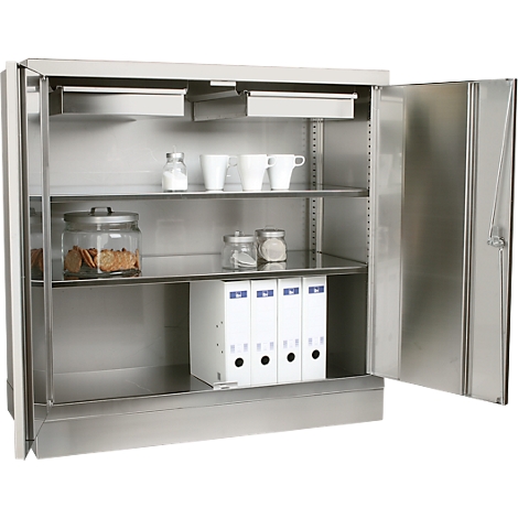 An open stainless steel cabinet with shelves. Inside: cups, cookies, file folders and spices.
