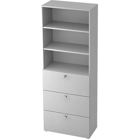 Tall, gray bookcase with open shelves and three drawers with golden knobs.
