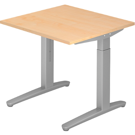 An adjustable height desk with a beige tabletop and silver frame. The tabletop is square.