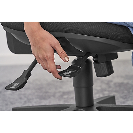 Close-up of a hand operating a lever under a black office chair, presumably for height adjustment.