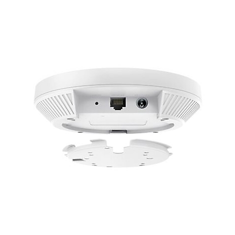 Vue de dessus d'un appareil wifi blanc planant sur un fond blanc avec l'élément de montage retiré. Arrière avec ports.