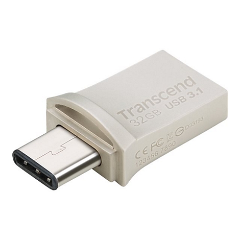 Une clé USB argentée de type C. Inscription: Transcend, 32 Go, USB 3.1. Avec logo et numéro de série.