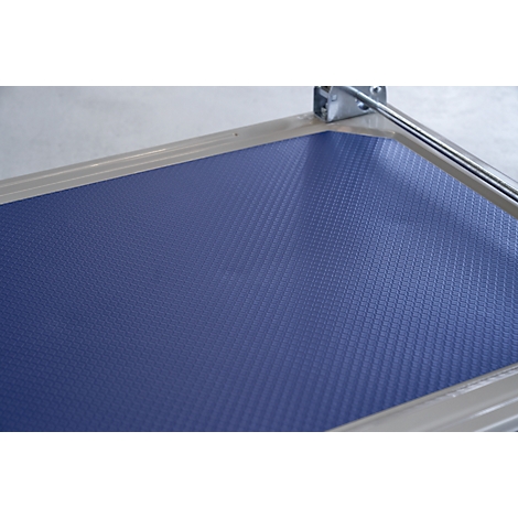 Blue textured surface in a silver frame. A metal part is visible in the top right corner.