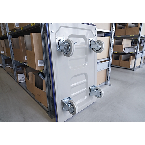 Beige transport cart with four wheels, in front of shelves with boxes.