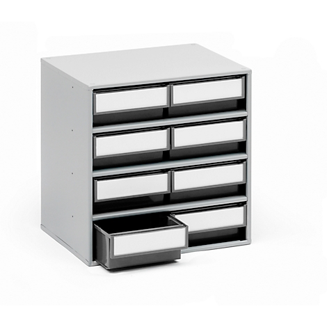 Grey, slanted drawer cabinet with eight drawers. One drawer is open.