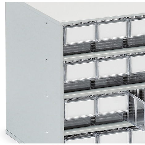 Grey drawer system with white labels, one drawer is open.