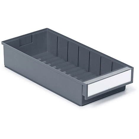 Gray plastic box with compartments. A white label is attached to the front. The picture shows the box slightly diagonally from above.