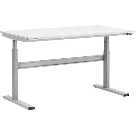 Bureau blanc réglable en hauteur. Les pieds du bureau sont en métal gris.